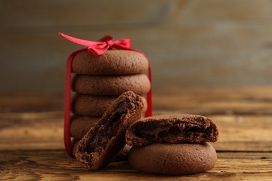 Photo of Tasty homemade chocolate cookies on wooden table