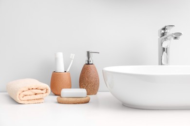 Set of different bath accessories and products on white table