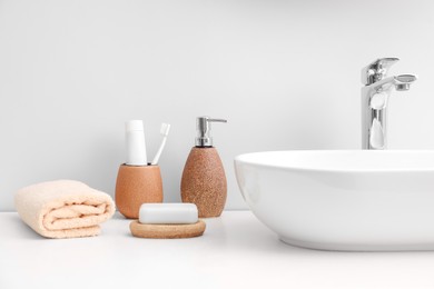 Photo of Set of different bath accessories and products on white table