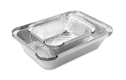 Photo of Many different aluminum foil containers isolated on white