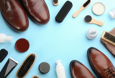 Photo of Flat lay composition with shoe care accessories and footwear on light blue background. Space for text