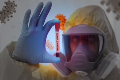 Image of Scientist in chemical protective suit holding test tube with blood sample. Monkeypox virus