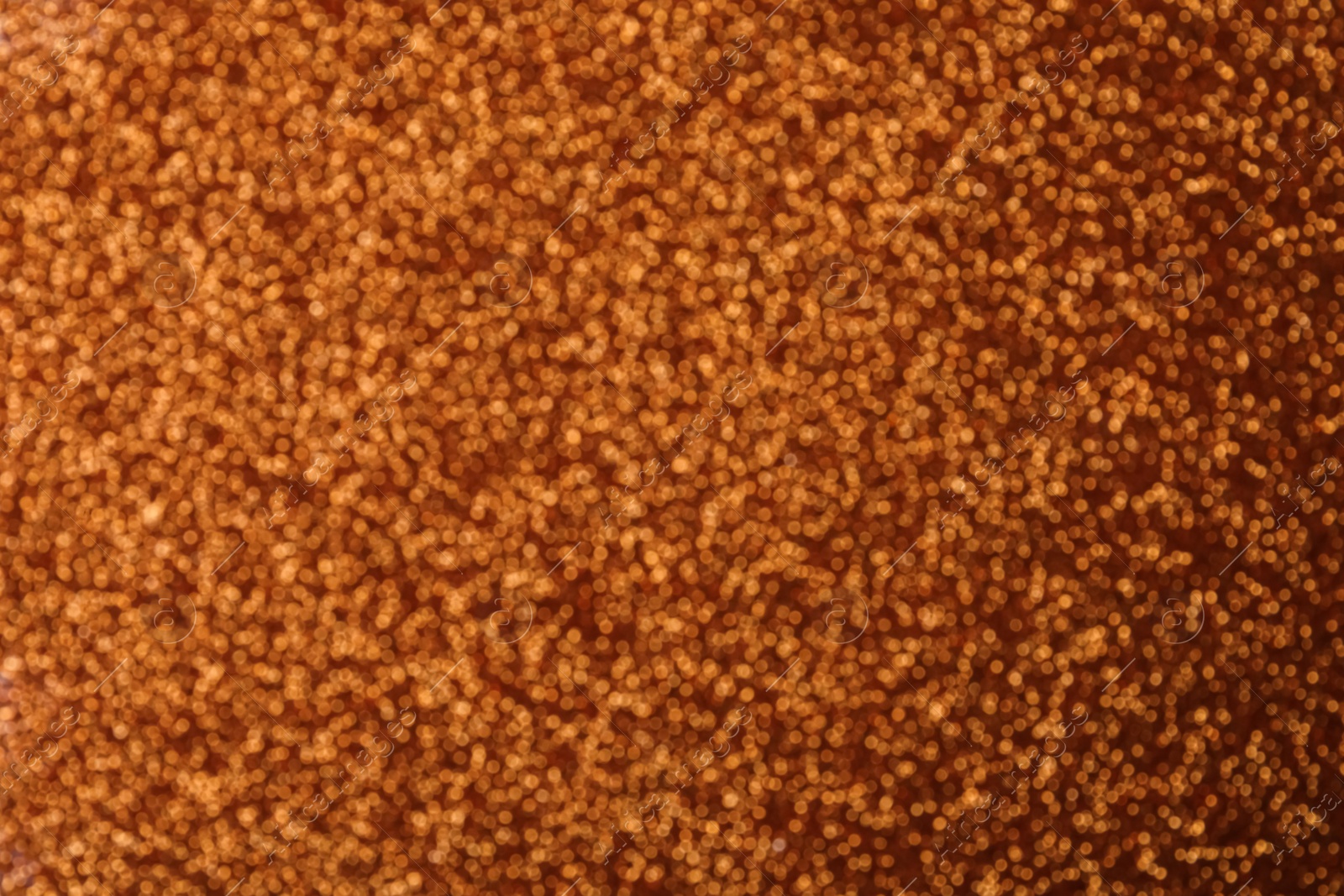 Photo of Shiny copper background with magical bokeh effect