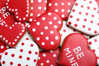 Photo of Delicious heart shaped cookies as background, top view. Valentine's Day