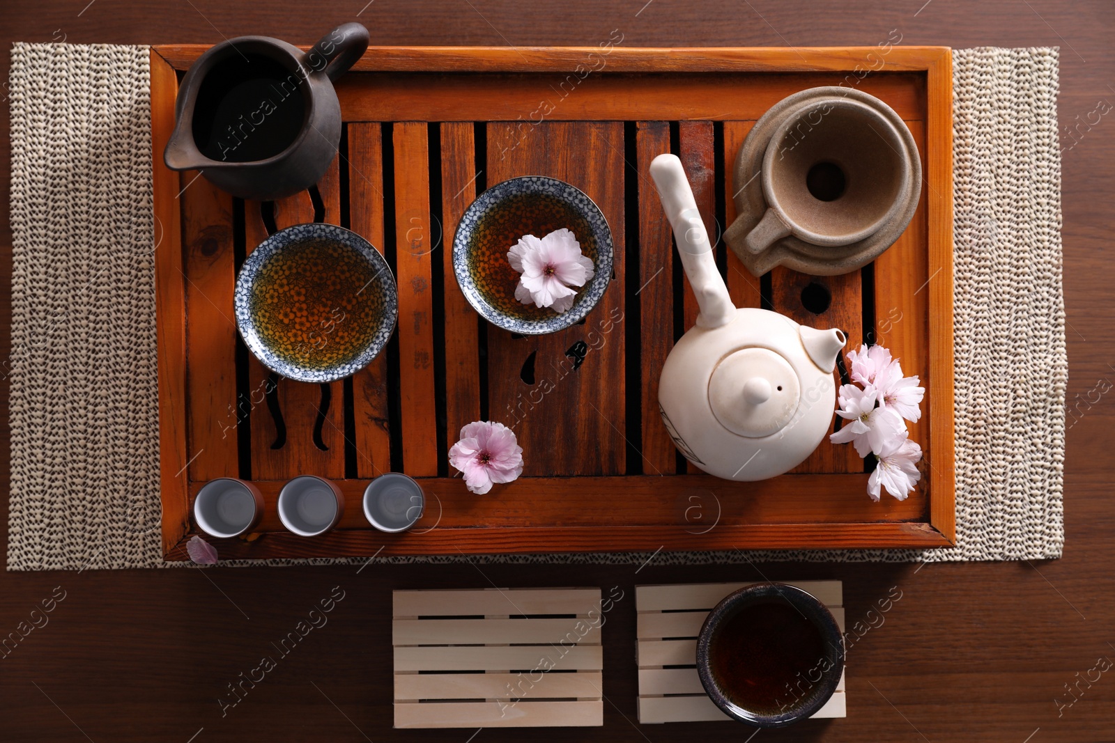 Photo of Beautiful set for traditional tea ceremony on wooden table, flat lay