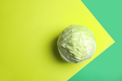 Photo of Ripe cabbage on color background, top view