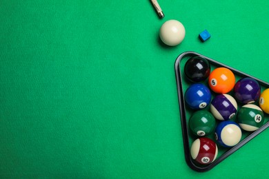 Flat lay composition with balls on billiard table, space for text