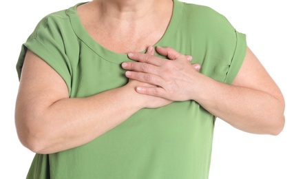 Mature woman having heart attack on white background