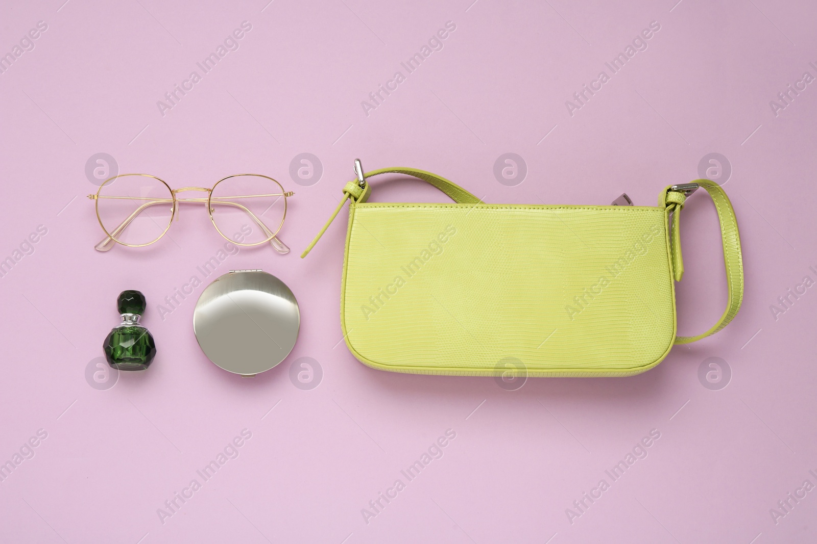 Photo of Flat lay composition with stylish baguette handbag on lilac background