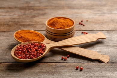 Photo of Composition with aromatic red pepper on wooden table