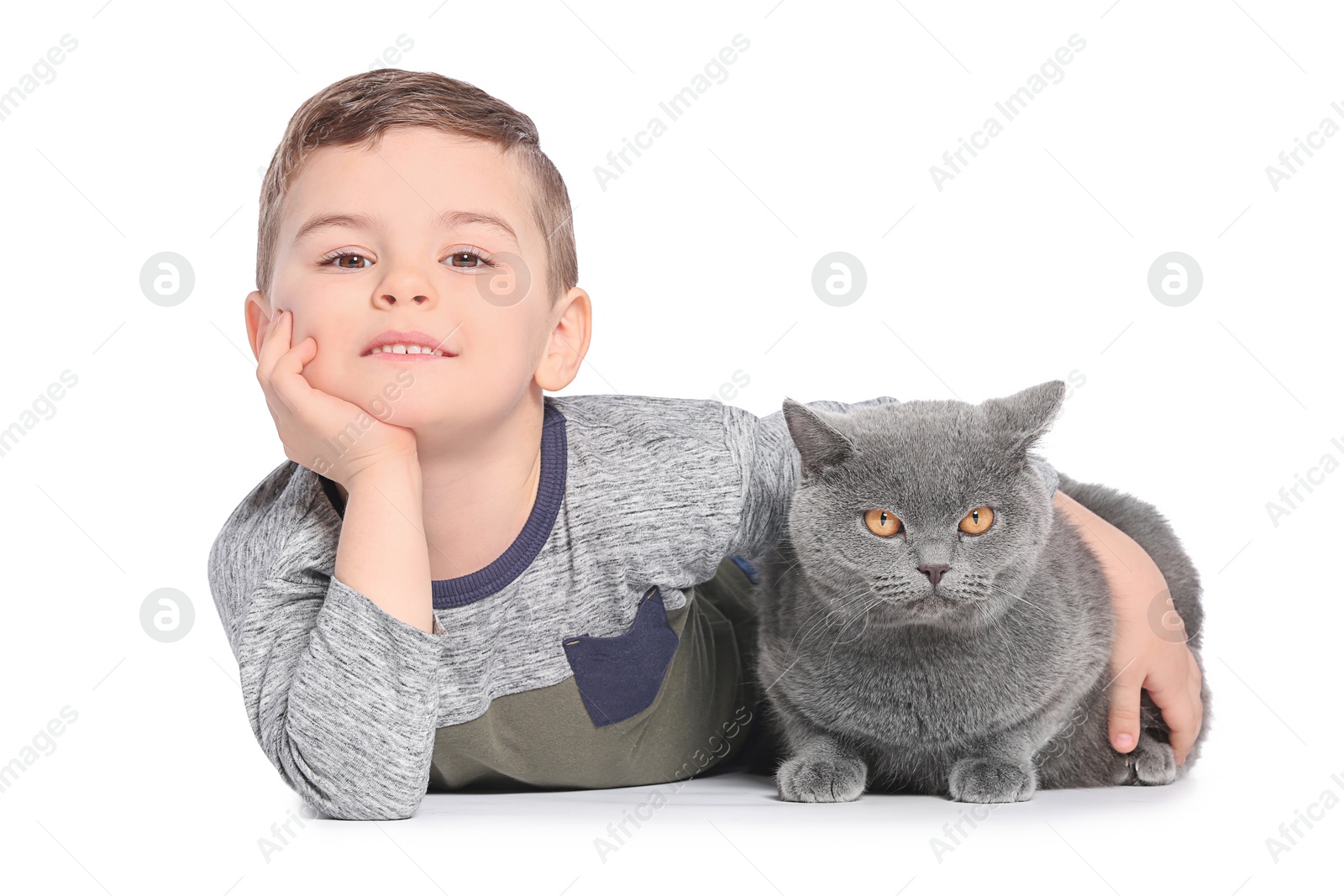 Photo of Cute little child with cat on white background