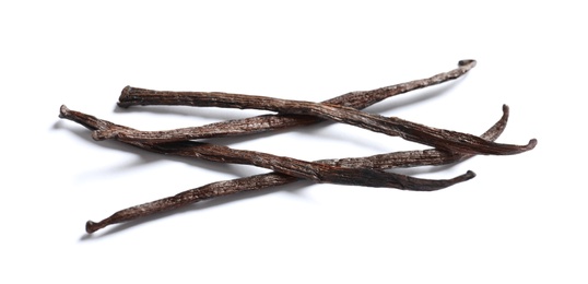 Photo of Aromatic vanilla sticks on white background