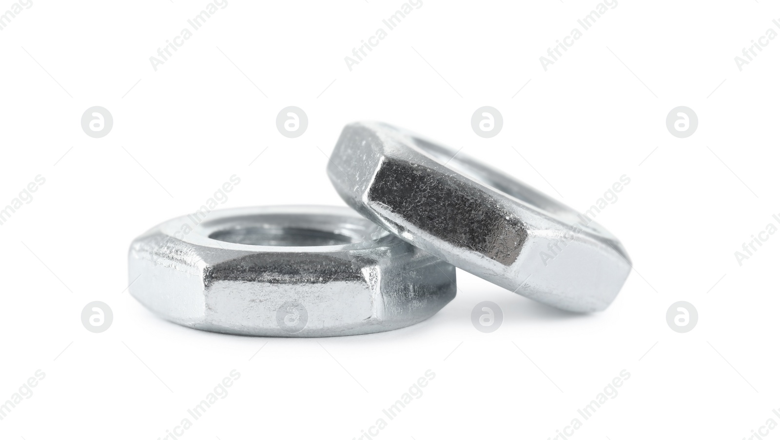Photo of Two metal jam nuts on white background