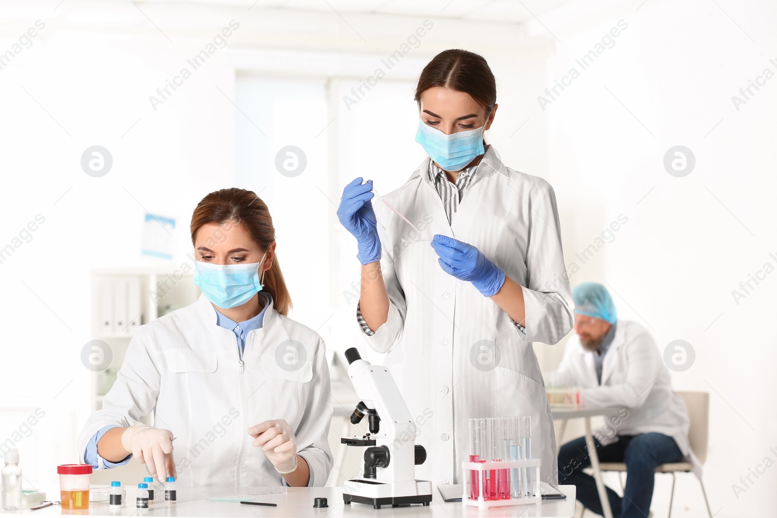 Photo of Scientists working in laboratory. Research and analysis