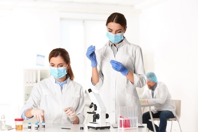 Photo of Scientists working in laboratory. Research and analysis