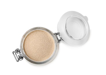 Granulated yeast in glass jar isolated on white, top view