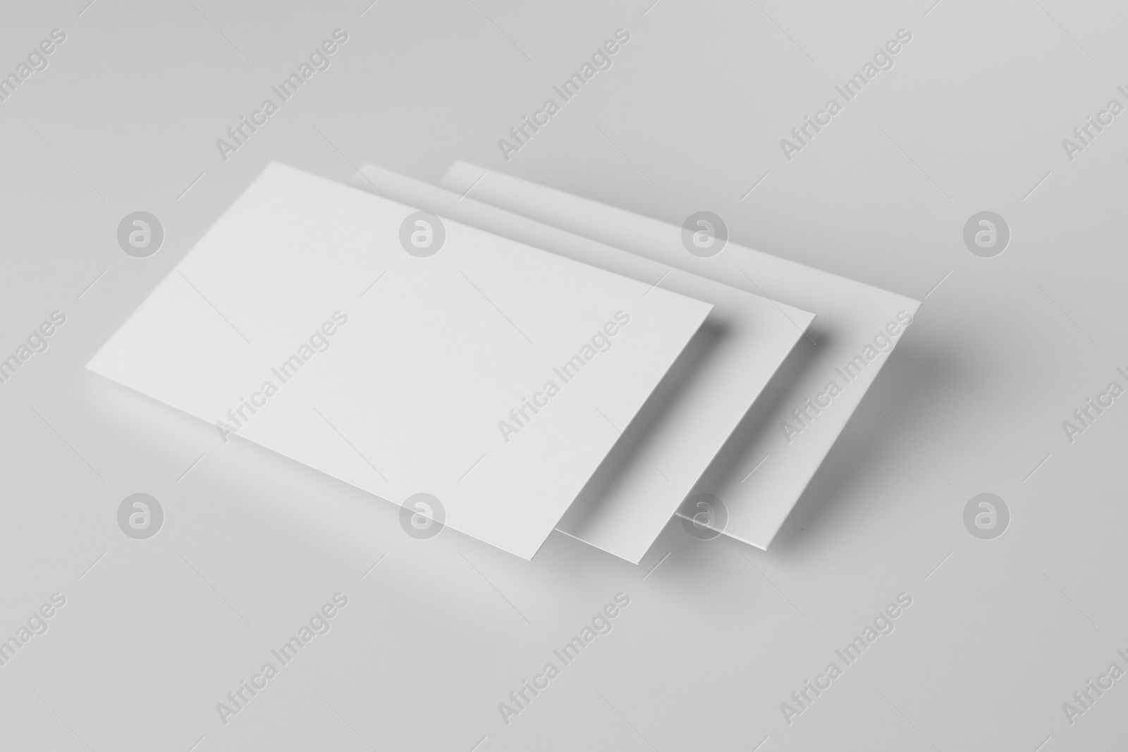 Photo of Blank business cards on white background. Mockup for design