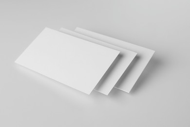 Photo of Blank business cards on white background. Mockup for design