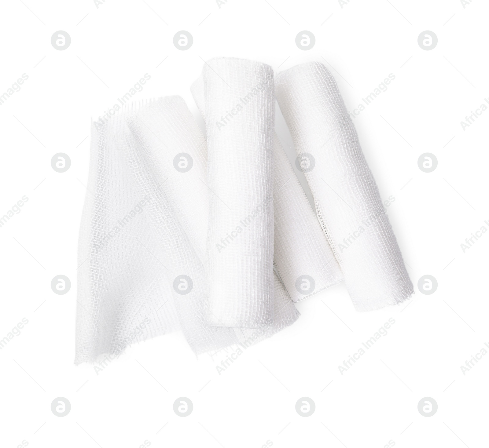 Photo of Medical bandage rolls on white background, top view