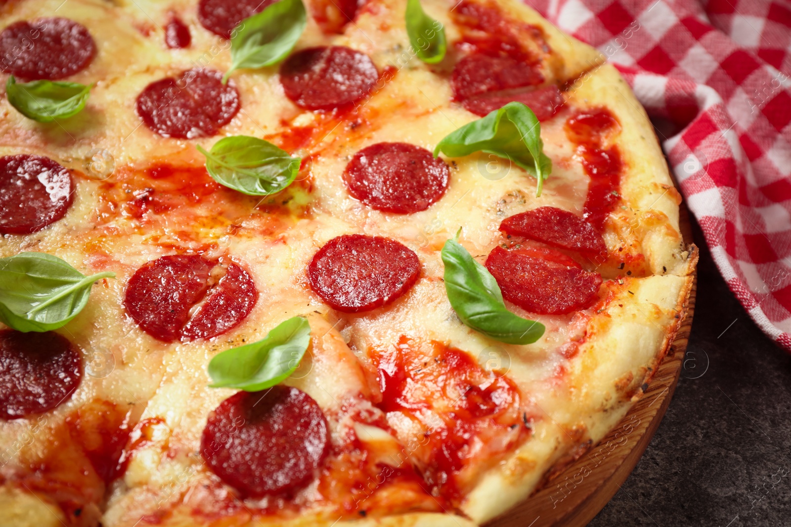 Photo of Hot delicious pepperoni pizza on table, closeup