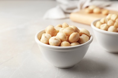 Photo of Bowl with shelled organic Macadamia nuts on light table