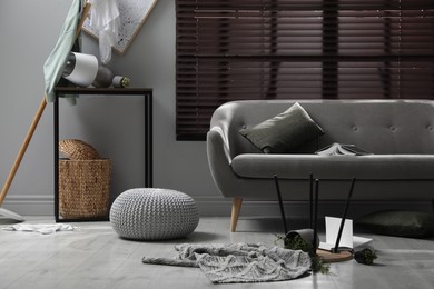 Photo of Chaotic living room interior after strong earthquake