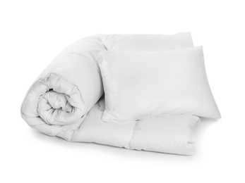 Clean blanket and pillows on white background