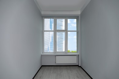 Photo of New empty room with clean windows and white walls