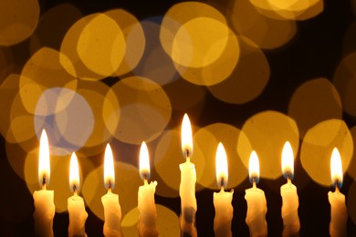 Hanukkah celebration. Burning candles against blurred lights