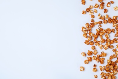 Photo of Flat lay composition with caramel popcorn and space for text on white background