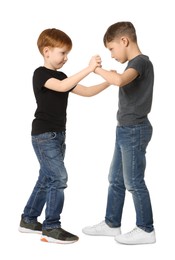 Photo of Two boys fighting on white background. Children's bullying