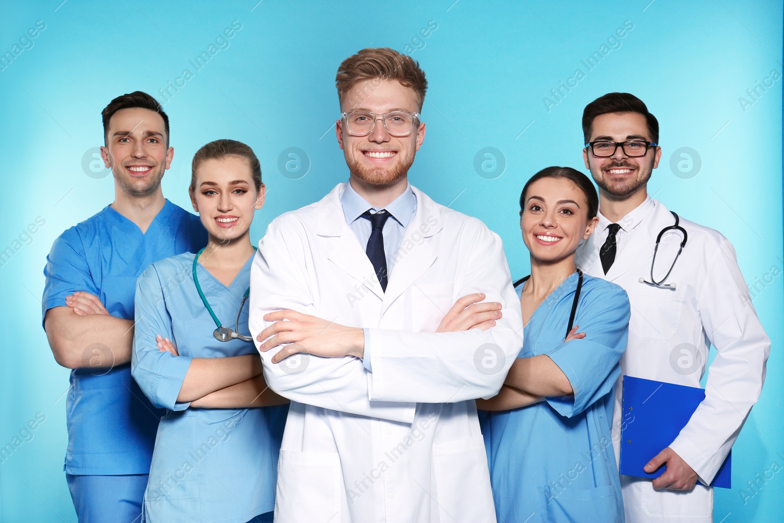 Photo of Group of medical doctors on color background. Unity concept
