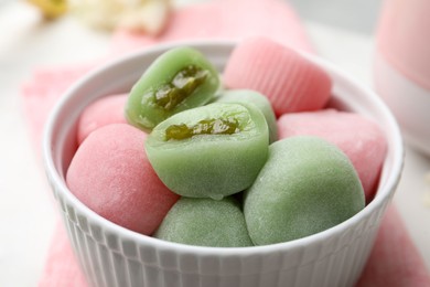 Delicious mochi in bowl on table, closeup. Traditional Japanese dessert