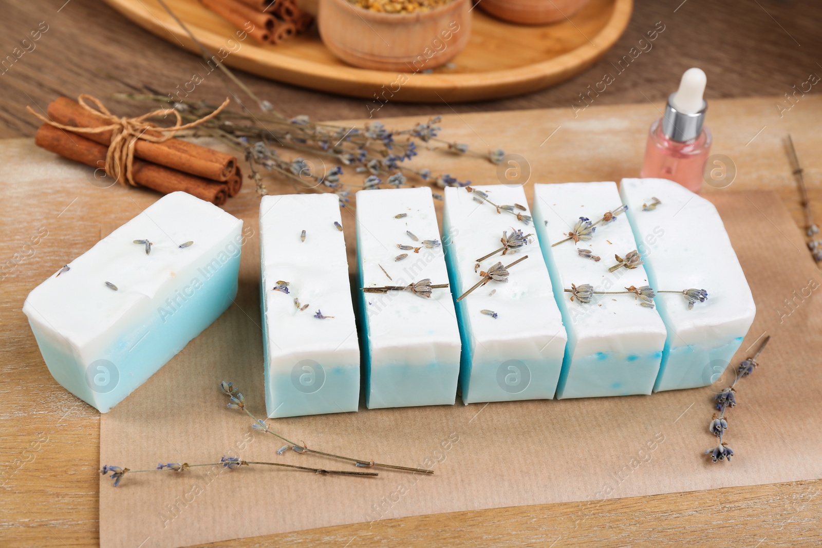 Photo of Natural handmade soap with lavender on wooden table