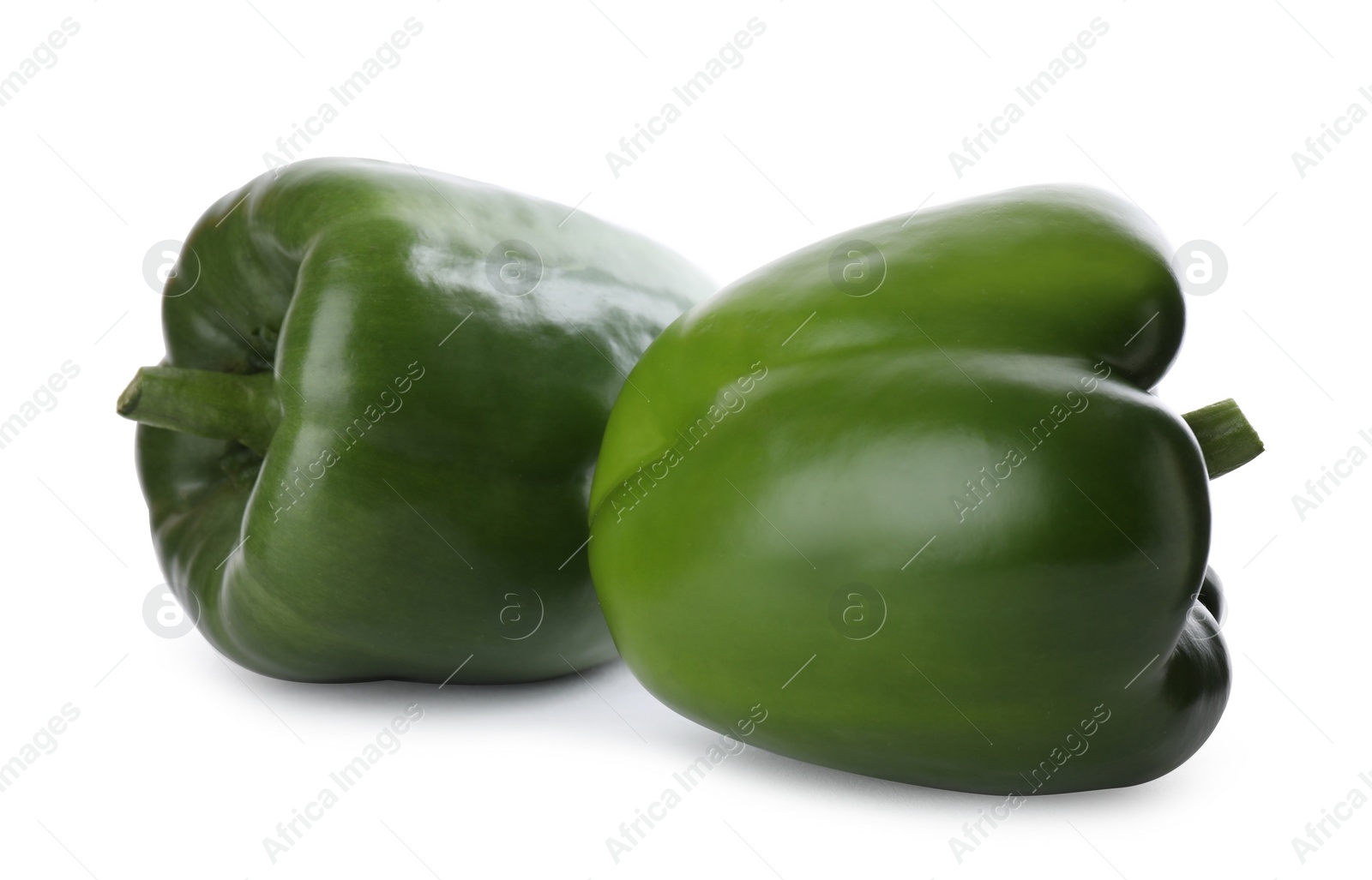 Photo of Ripe green bell peppers isolated on white