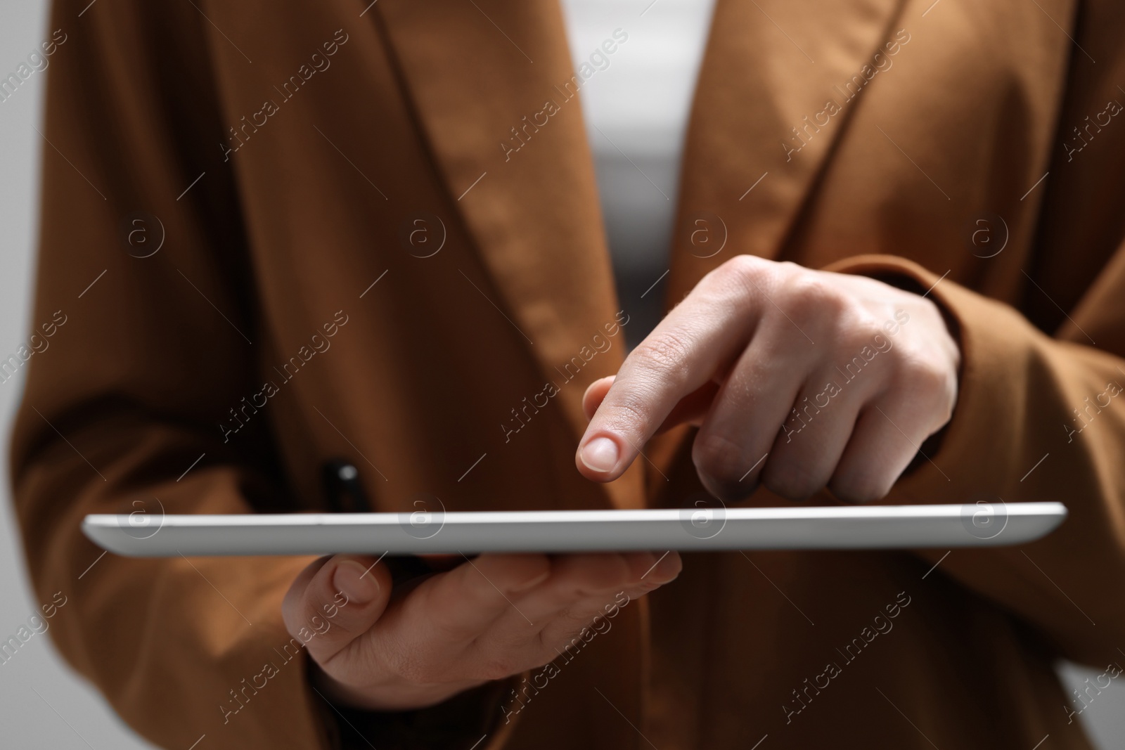 Photo of Closeup view of woman using modern tablet