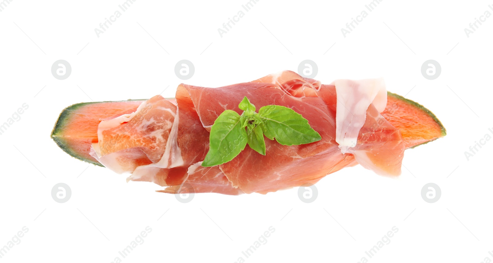 Photo of Slice of fresh melon with prosciutto and basil on white background, top view