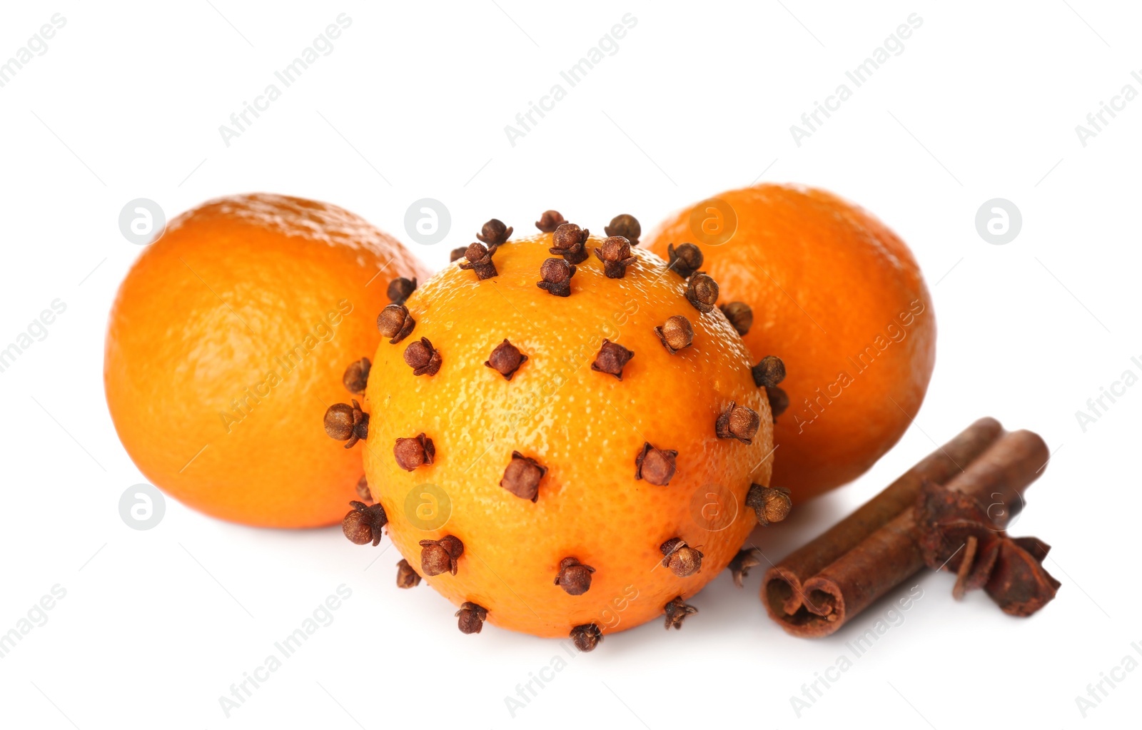 Photo of Pomander ball, fresh tangerines and cinnamon with anise star on white background
