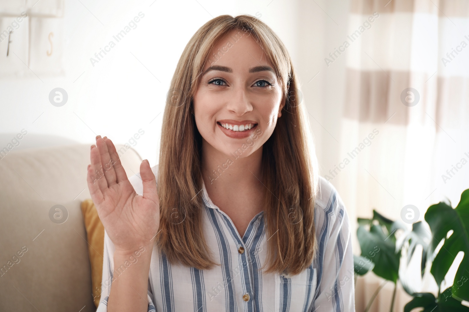 Photo of Woman using video chat at home, view from video camera