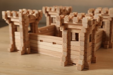 Wooden fortress on table, closeup. Children's toy