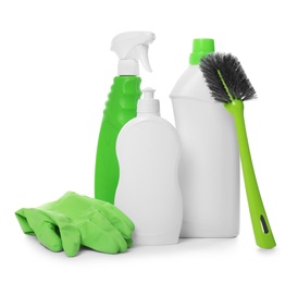 Different cleaning products and tools on white background