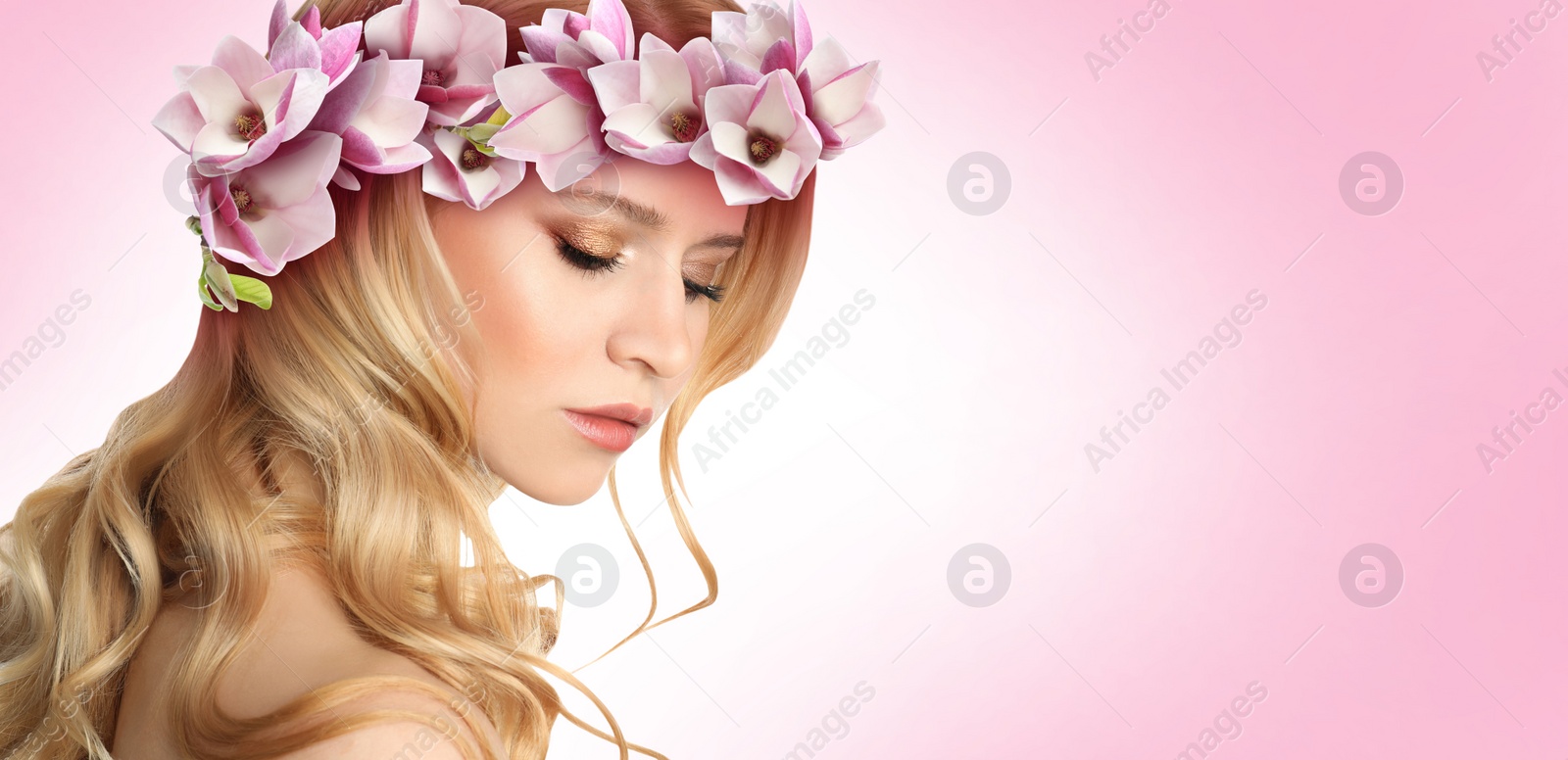 Image of Pretty woman wearing beautiful wreath made of flowers on pink background, space for text. Banner design