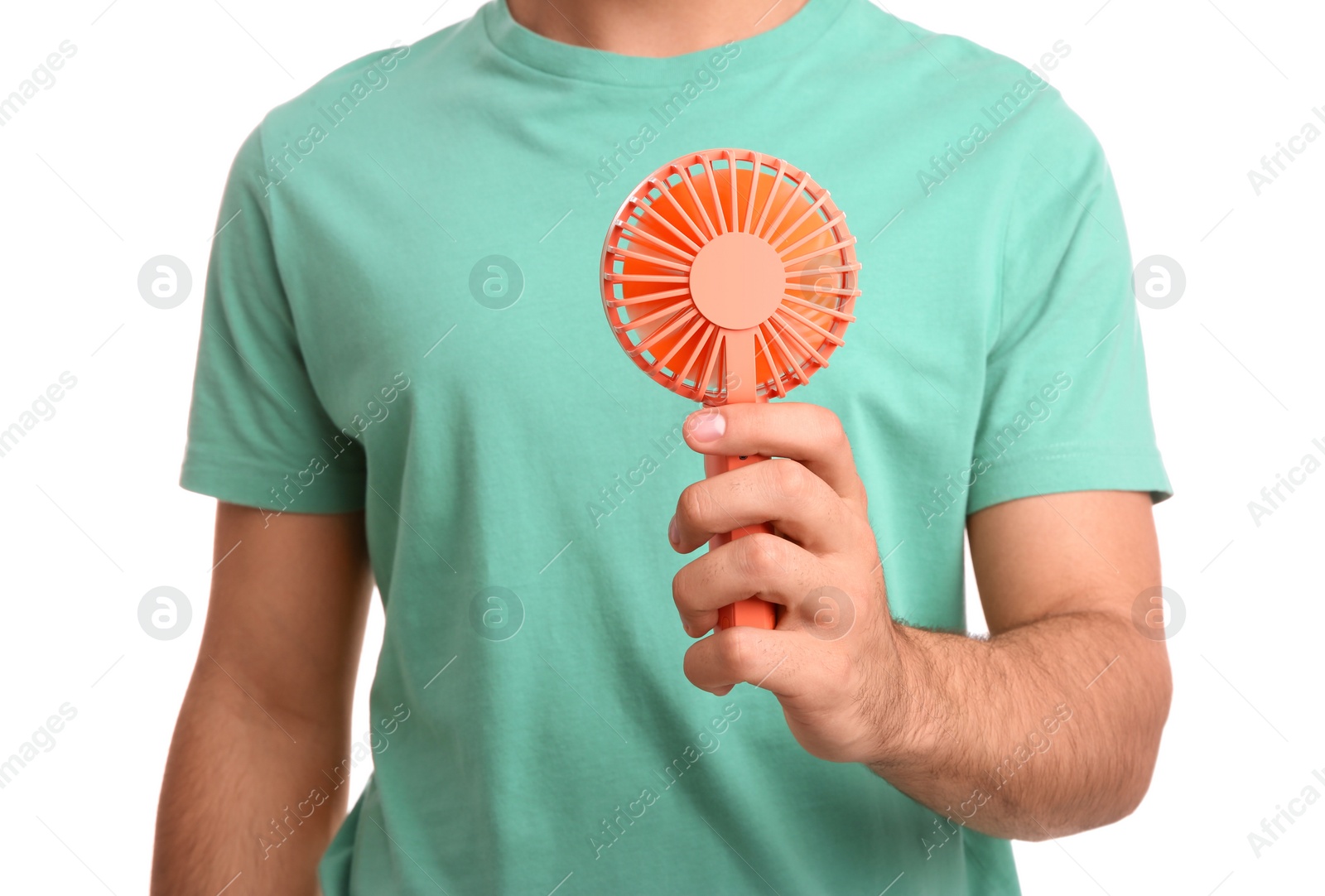 Photo of Man with portable fan on white background, closeup. Summer heat