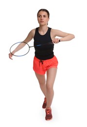 Young woman playing badminton with racket on white background