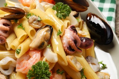 Delicious pasta with sea food on table, closeup