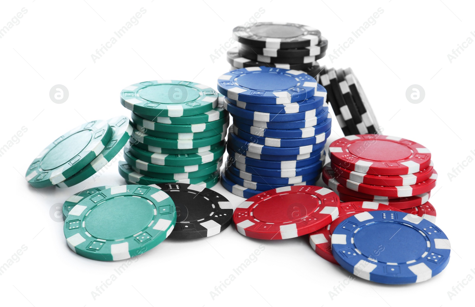 Photo of Plastic casino chips stacked on white background. Poker game