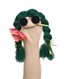 Photo of Funny sock puppet with braids, sunglasses and flower isolated on white