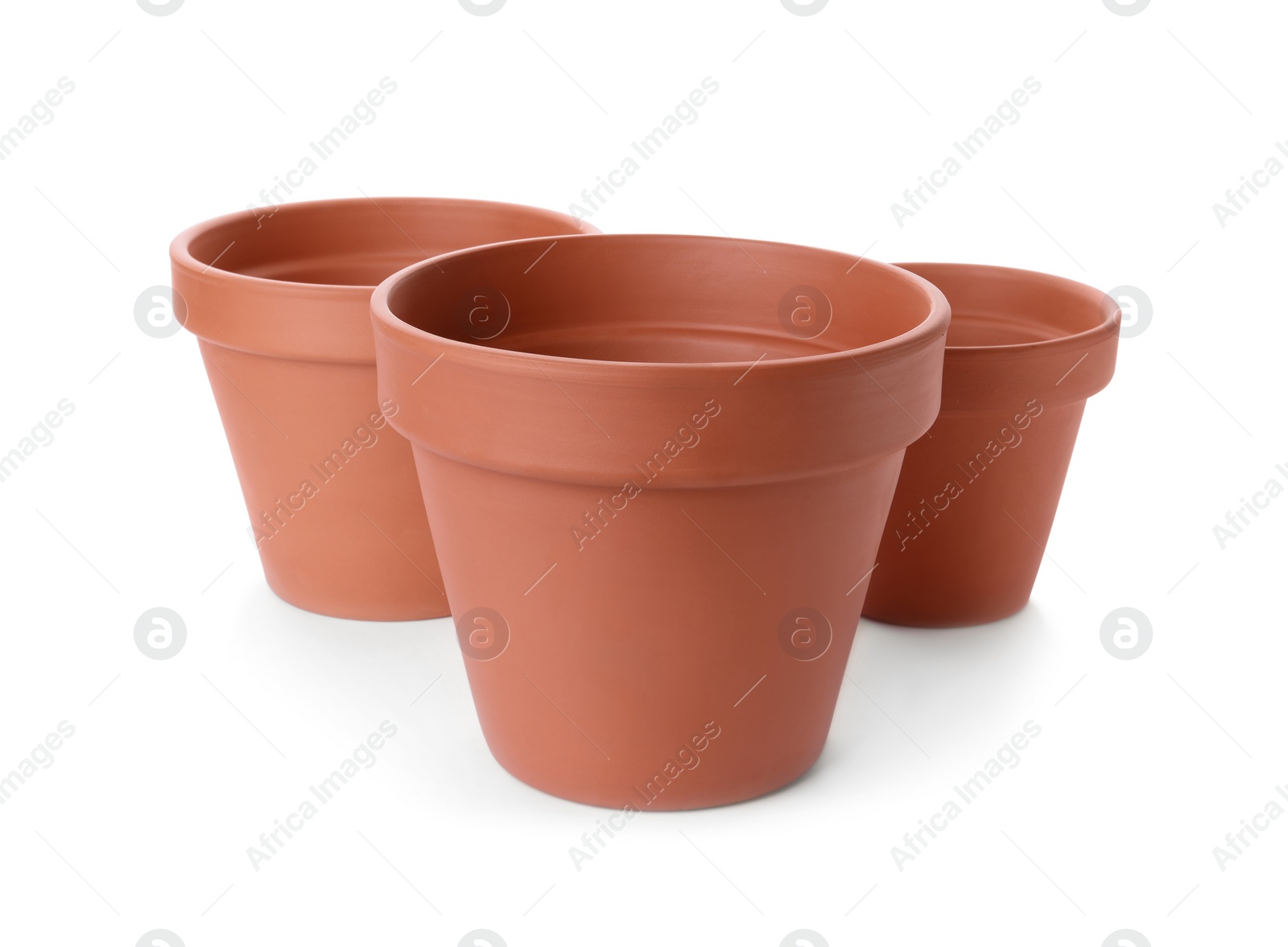 Photo of Stylish terracotta flower pots isolated on white