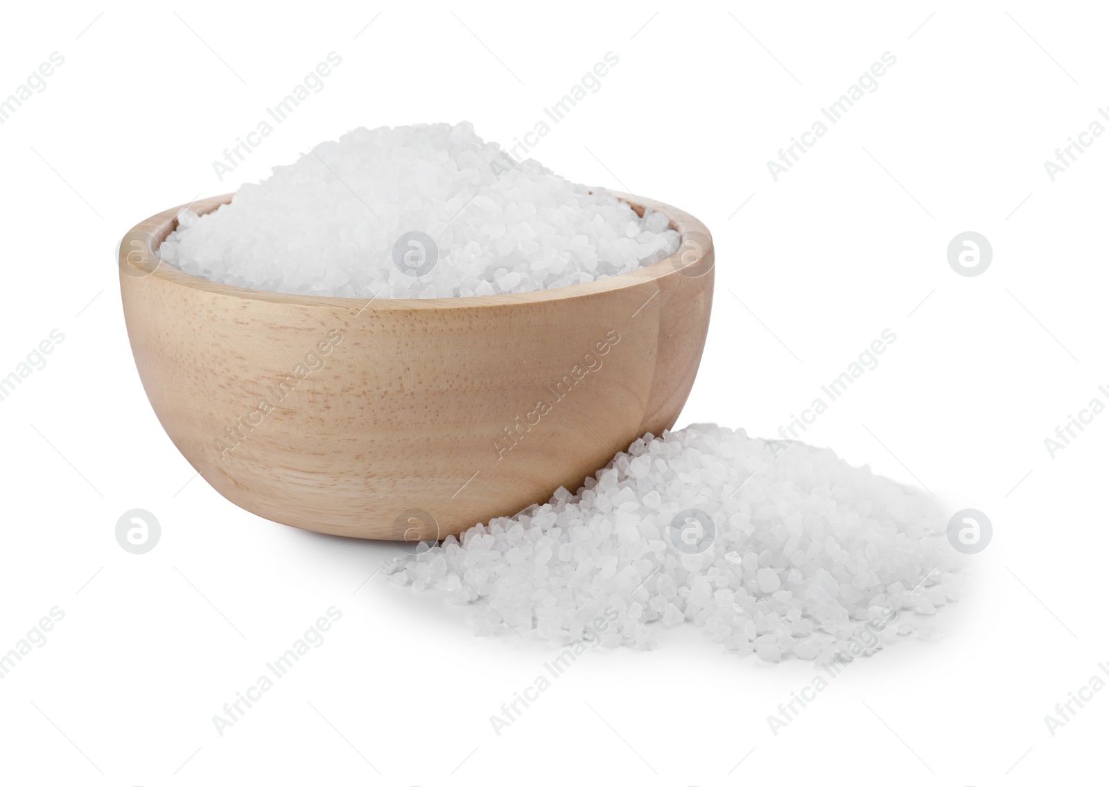 Photo of Wooden bowl and heap of natural sea salt isolated on white