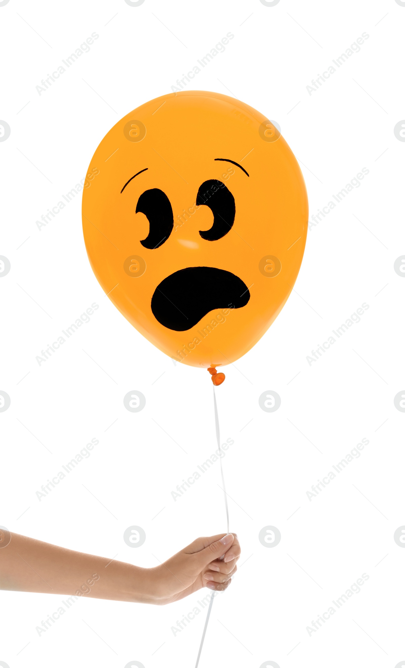 Photo of Woman holding orange balloon for Halloween party on white background